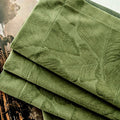 Rideau velours vert olive à motif feuilles